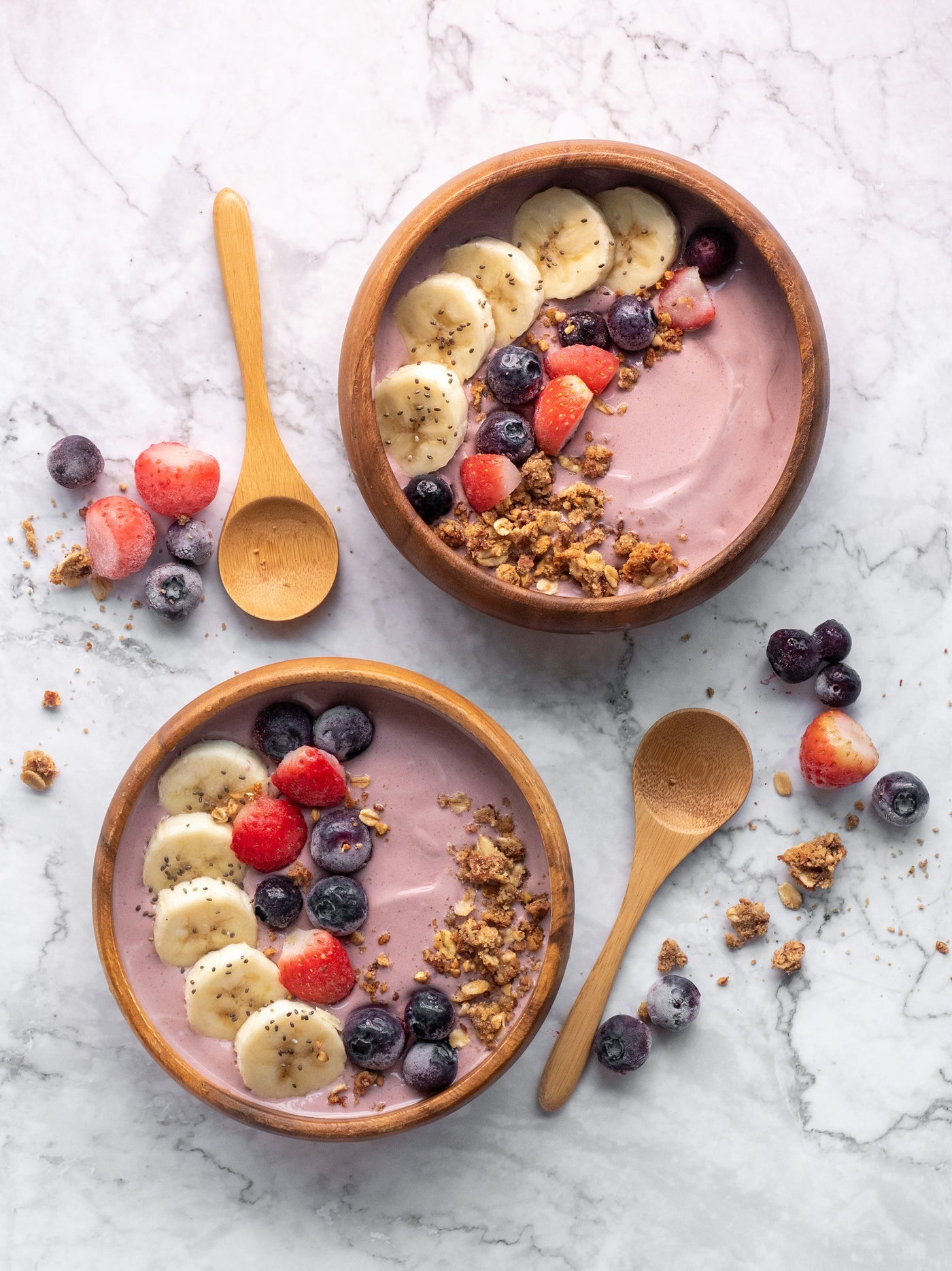 Açaí bowl with banana slices, berries, and granola